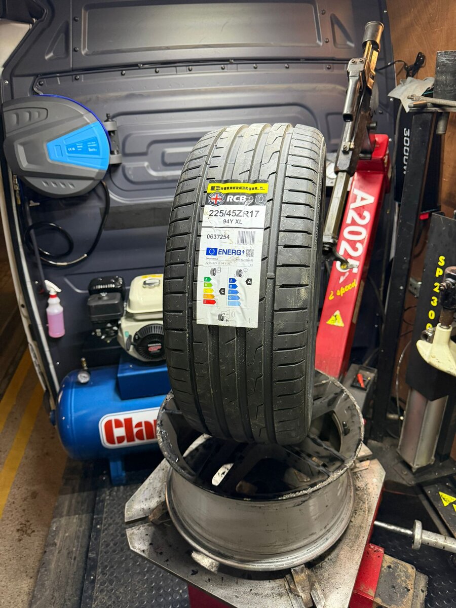 Close-up of a 225/45 tyre on a wheel rim inside the Breakdown Man mobile tyre fitting van.