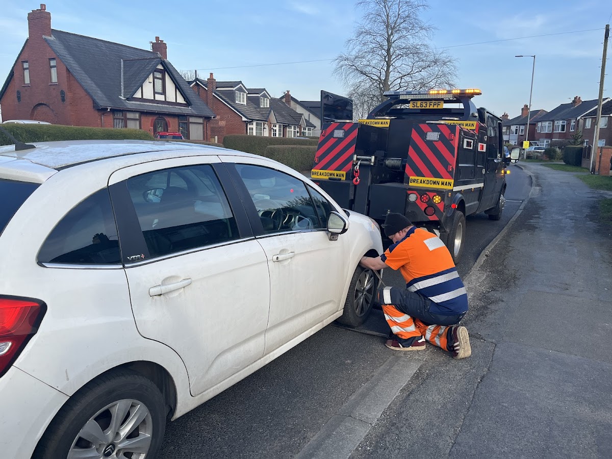 Simon changing a tyre on a Citroen in a residential area.