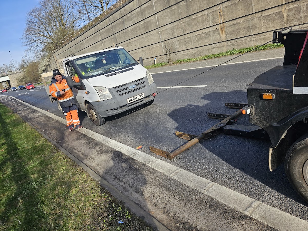 Simon towing a Ford Transit on the motorway.