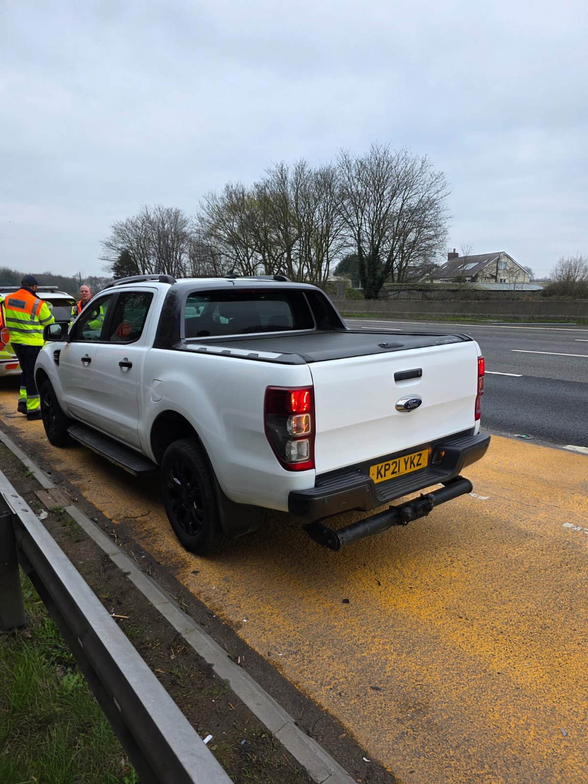 Vehicle on motorway hard shoulder.