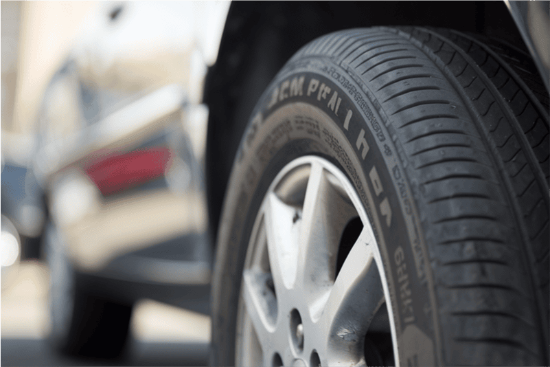 A close up of a new tyre on a car.